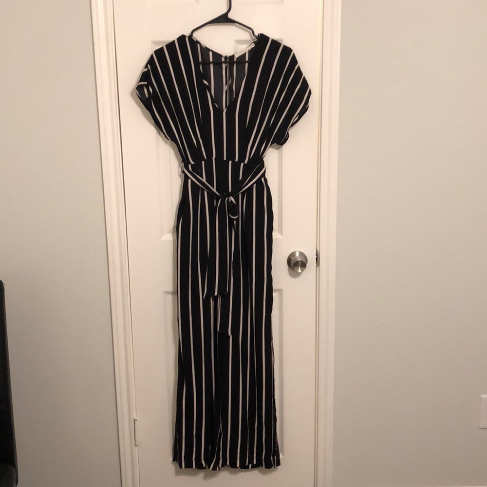 Black, white, and dark red striped jumpsuit with front tie belt.